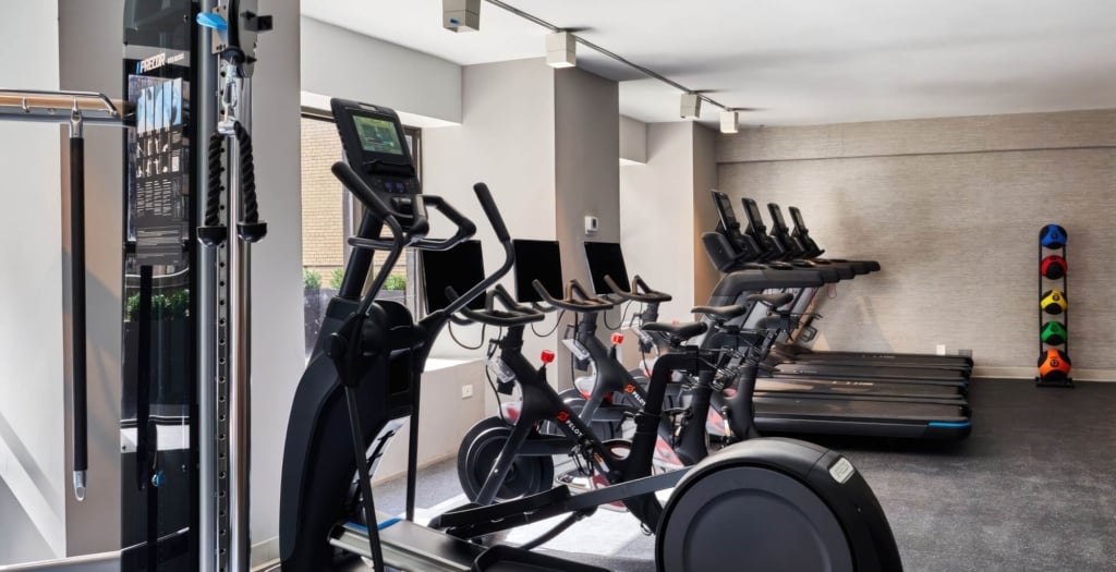 Exercise bikes and treadmills in a hotel gym