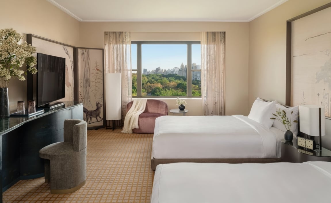 A double queen room at Park Lane New York overlooking Central Park.