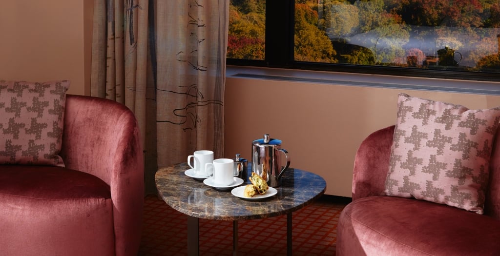 The seating area of a suite overlooking Central Park.