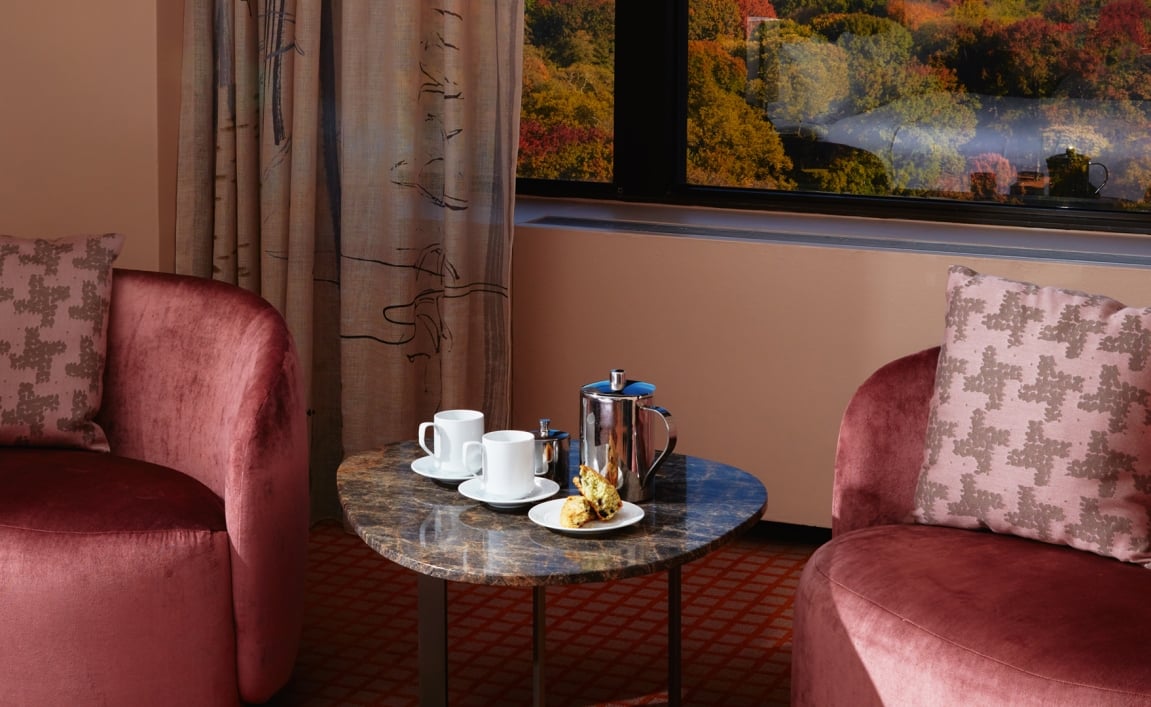 The seating area of a suite overlooking Central Park.