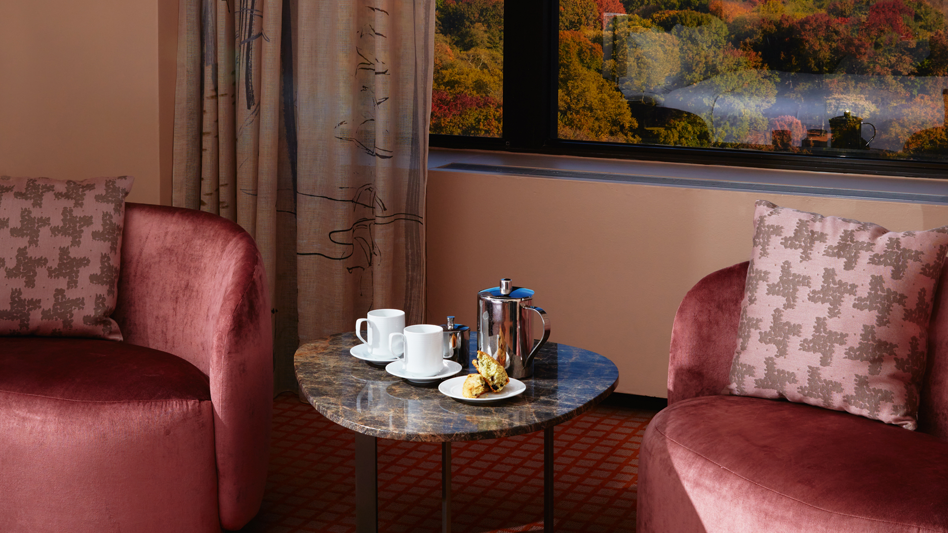 The seating area of a suite overlooking Central Park.