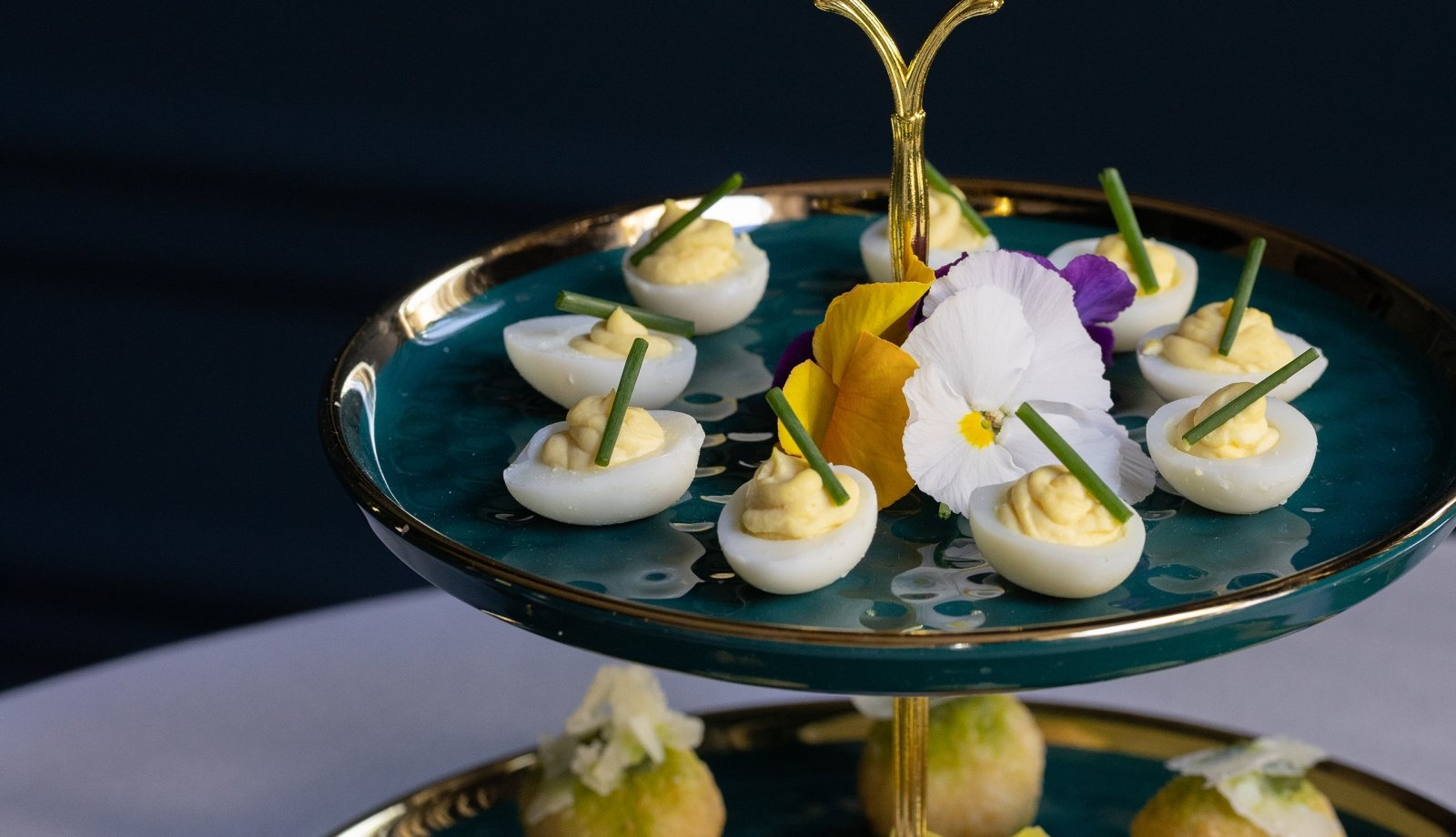 A tiered tray of hors d'oeuvres.