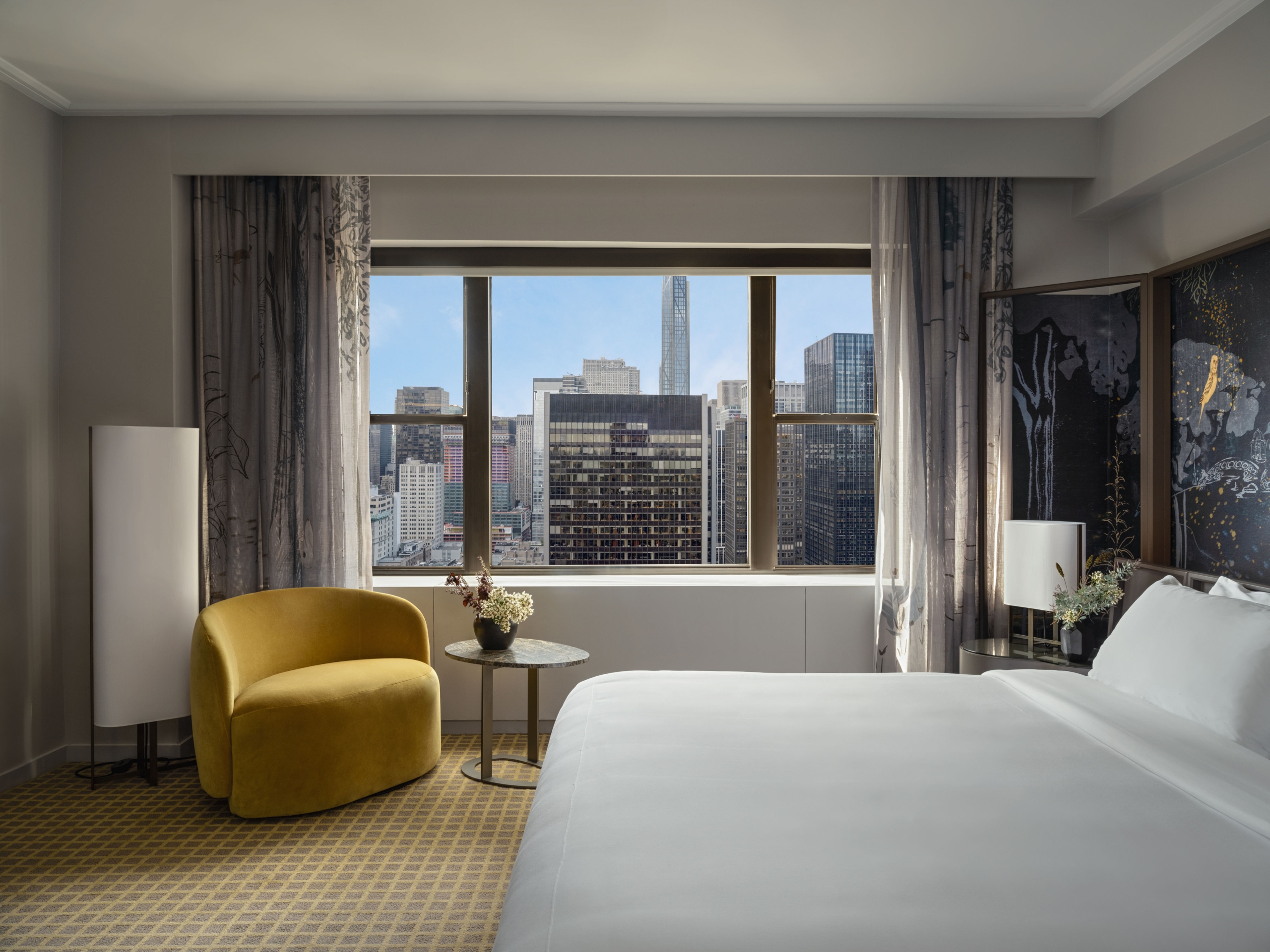 A king bed with city view at Park Lane New York.