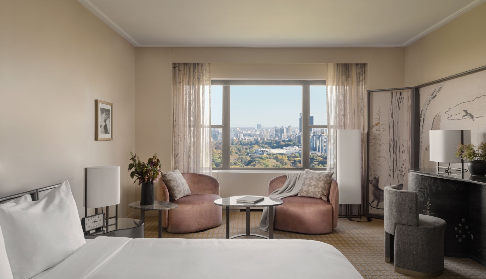 A king suite at Park Lane New York overlooking Central Park.