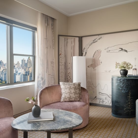 The seating area of a king suite overlooking Central Park at Park Lane New York.