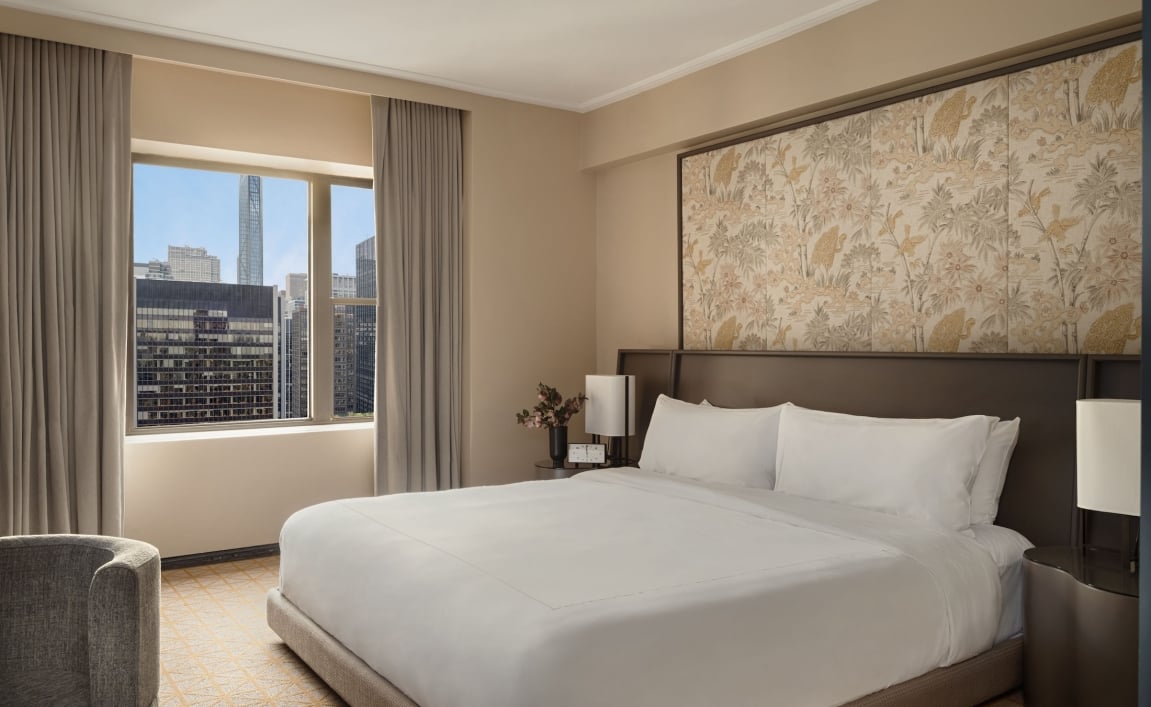 A king bed in a suite at Park Lane New York.