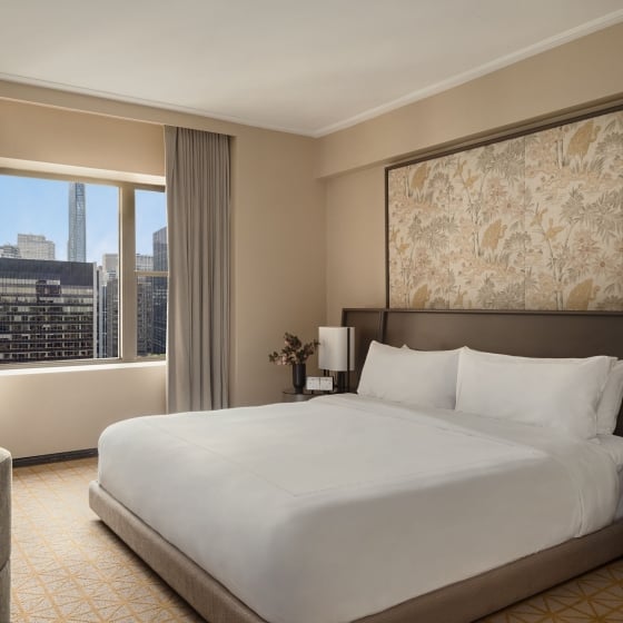 A king bed in a suite at Park Lane New York.