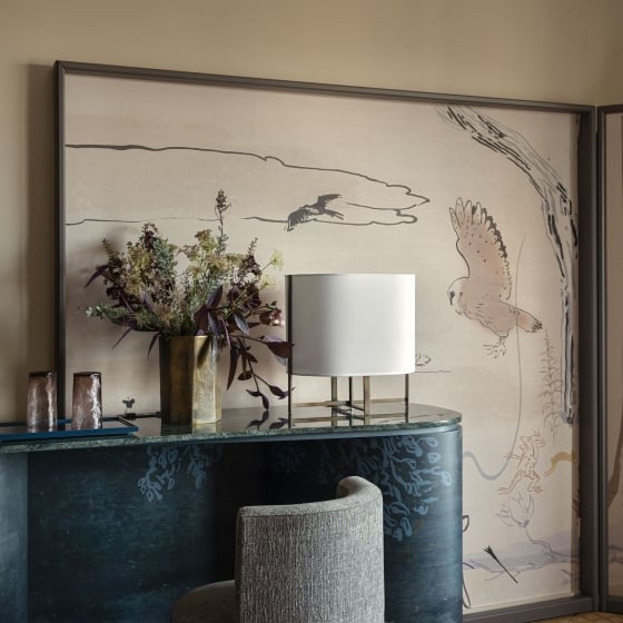 The desk and chair with a painted mural in a suite at Park Lane New York.