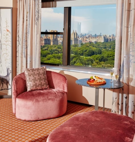 A seating area of a suite overlooking Central Park at Park Lane New York.